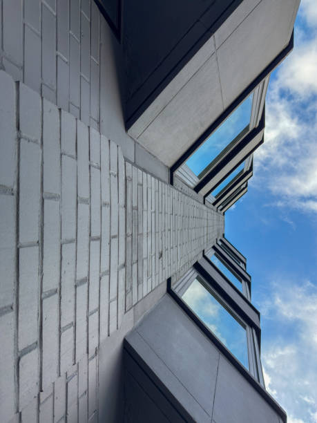 istock Modern Architecture Perspective – Looking Up at a Contemporary Building 2205103647