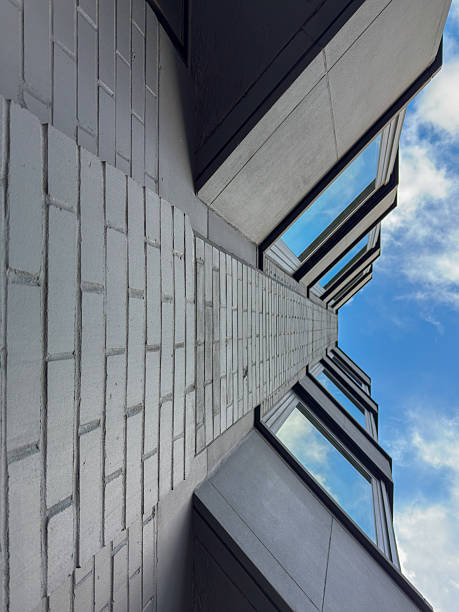 Symmetrical Perspective of Modern Brick Building with Reflective Windows