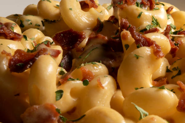 istock Mac and Cheese with Bacon Close Up 2205104642