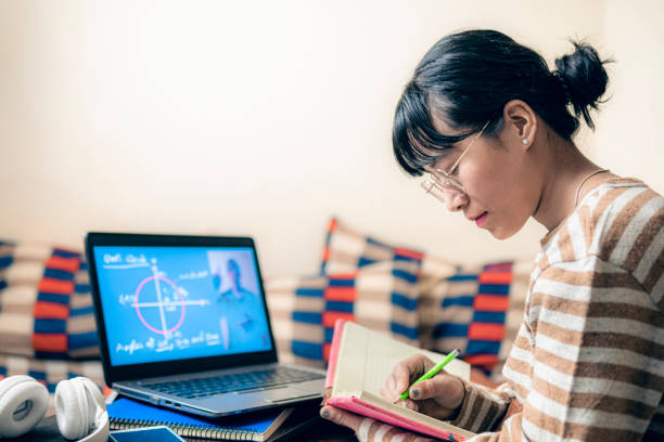 istock Young woman learns mathematics online at home. 2205105775