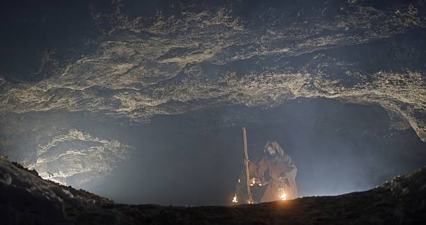 istock Exploring a Mysterious and Enigmatic Cave Beneath Dim and Soft Lighting, Embracing Adventure and Awe 2205105872