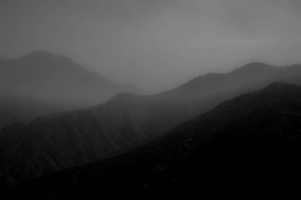 istock Misty range of mountain silhouettes. 2205106585