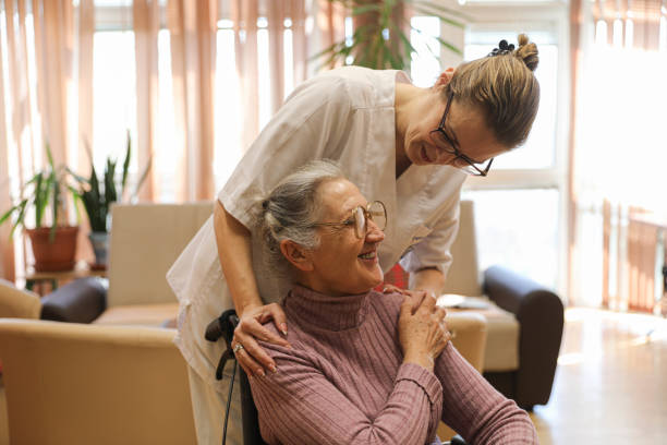 istock With Care and Respect: A Nursing Home Resident Receiving Help 2205107869