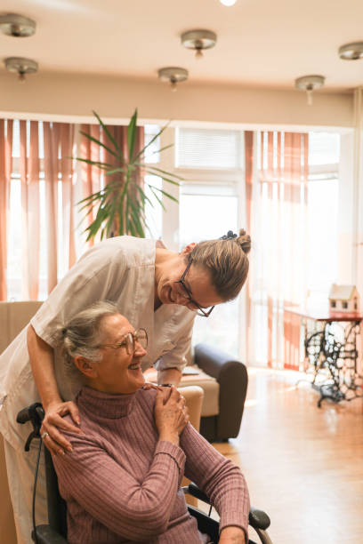 istock With Care and Respect: A Nursing Home Resident Receiving Help 2205107872