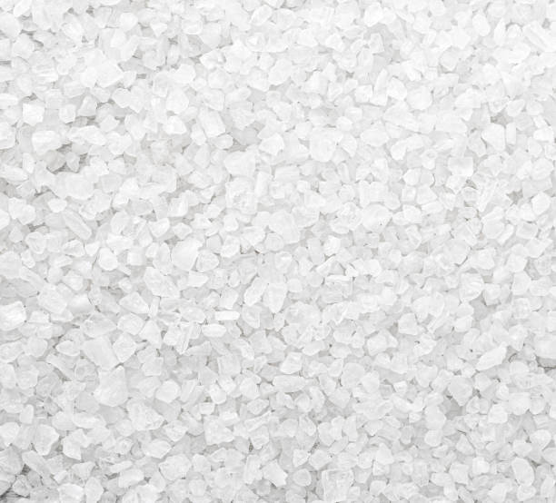 istock Coarse sea salt crystals forming an interesting textured background 2205108847