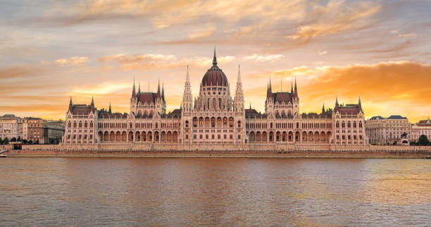 istock Hungarian parliament building reflecting on danube river at sunset in budapest 2205108852