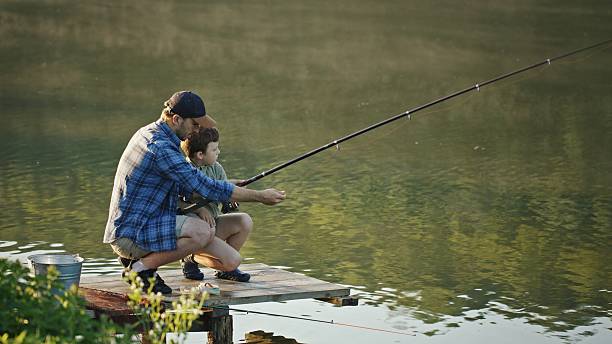 istock Fishing Together A Cherished Bond and Connection Between Parent and Child Through Nature 2205109794