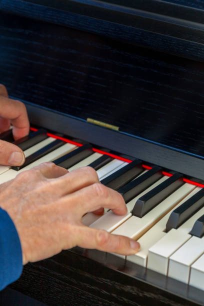 istock Black upright acoustic piano 2205114490