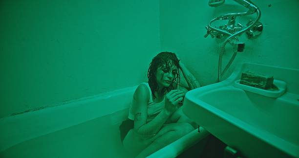 istock A moody and artistic bath scene illuminated with an intriguing green lighting, evoking deep emotion 2205114743