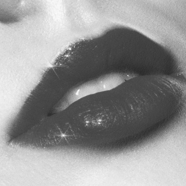 istock Close-up woman lips with sparkles 2205117064