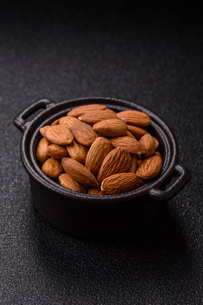 istock Roasted or raw peeled almonds in bowl 2205119615