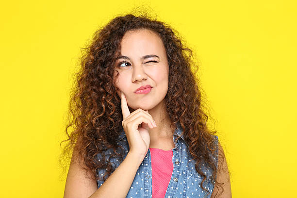 istock Young american girl on yellow background 2205119626