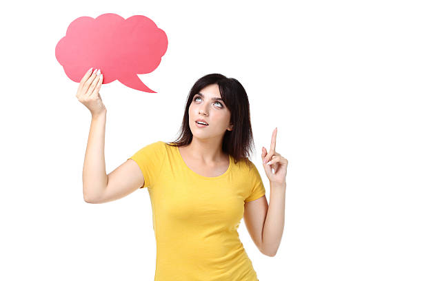 istock Young woman with speech bubble on white background 2205120716