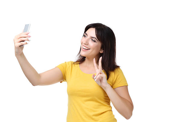 istock Young woman making selfie on white background 2205121571