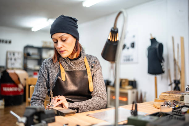 istock Artisan Craftswoman Working in Her Workshop with Focus and Precision 2205123670