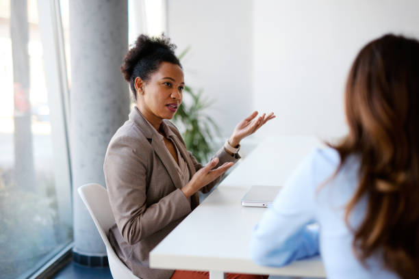 istock Businesswomen discussing during a meeting in a modern office 2205123920