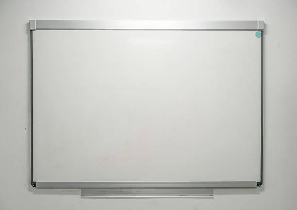 Close-up of a whiteboard and a green plant. Background, space for text, space for copying.