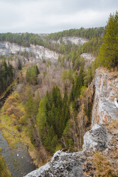istock A beautiful river flows serenely through a picturesque valley that is bordered by lush trees and rugged rocks, creating a stunning natural landscape that captivates the eye 2205126817