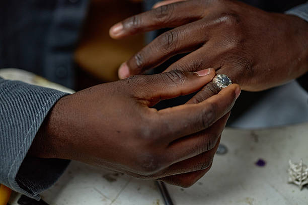 istock Delicately Handling Gemstone in Jewelry Workshop 2205128315