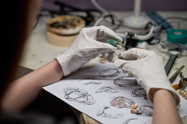 istock Working on Detailed Jewelry Design with Gloves 2205128347