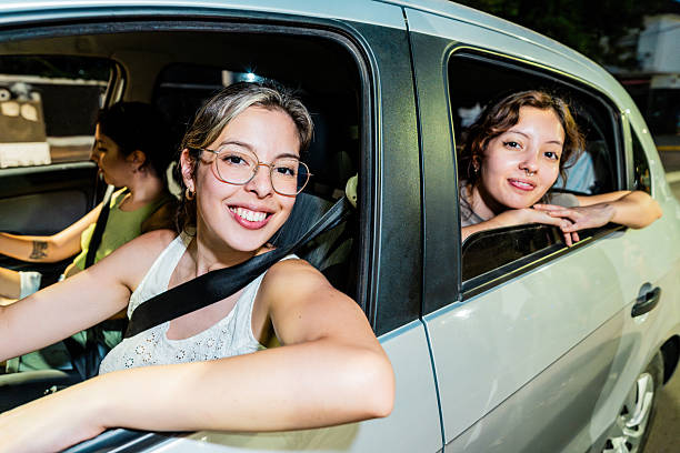 istock Portrait of sisters inside the car 2205133958