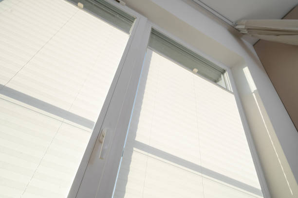 istock Morning sunlight filtering through cozy bathroom window with blinds 2205136906
