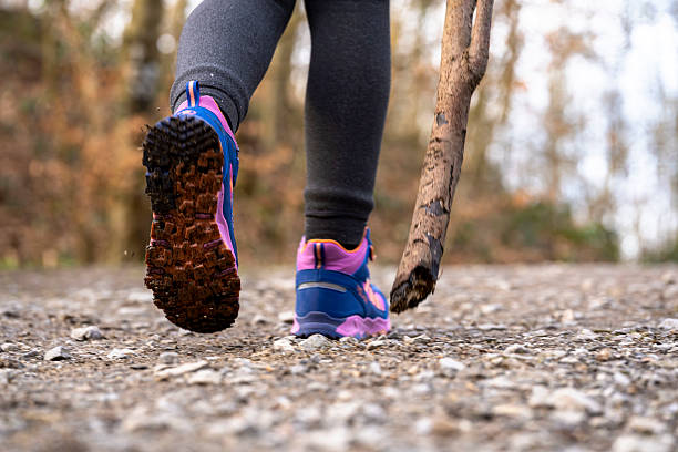istock hiking shoes outdoor with a pole3 2205137039