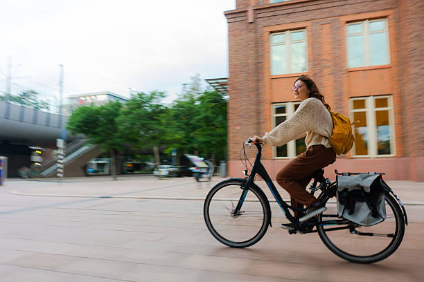 istock Woman commuting on sunny day with the bicycle 2205139656