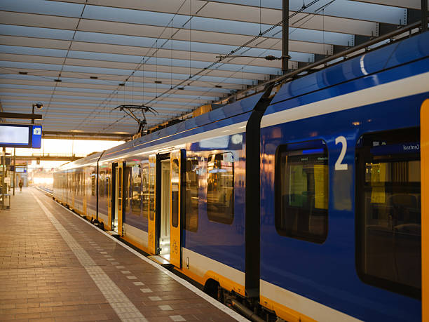 istock Train on sunlit station in Europe 2205139766