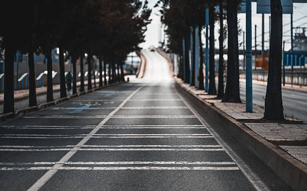Deserted road leading to an overpass