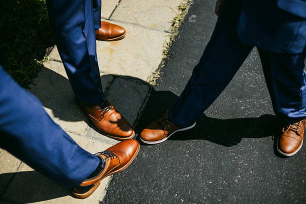 istock Three People with One Foot Forward in a Group Stance 2205144495