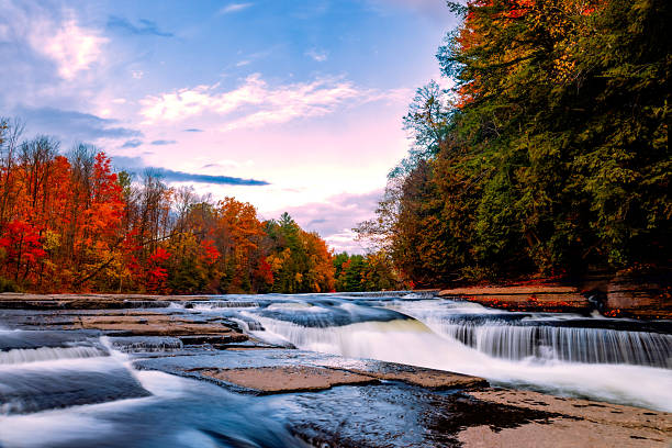 istock Autumn River View with Calm Waters and Vibrant Fall Foliage 2205144563