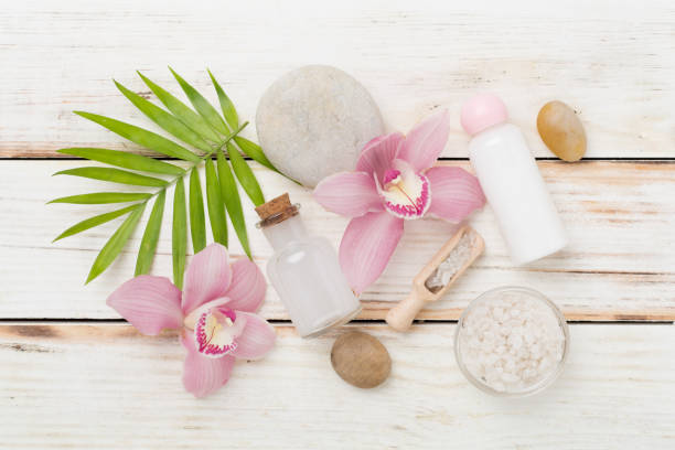 istock Composition with orchids, spa products on wooden background, top view 2205144688