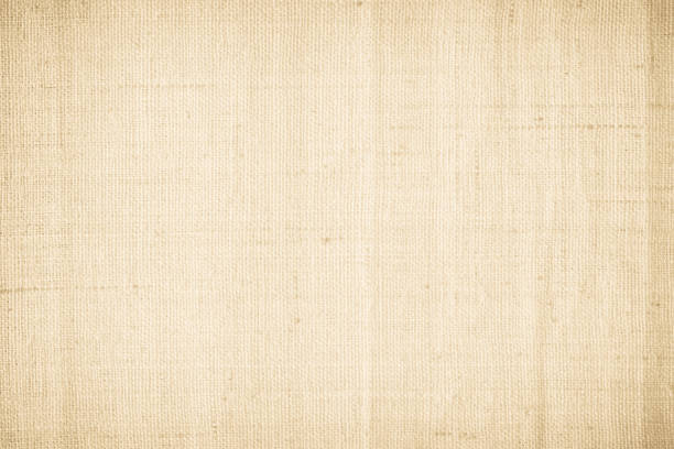 istock Brown sackcloth woven texture background in natural pattern. Jute hessian burlap, linen background in light beige cream color blank. Weaving canvas fiber line cotton cloth textured as organic. 2205147828