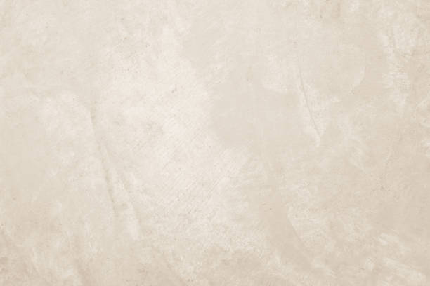 istock Colour old concrete wall texture background. Close up retro plain cream color cement wall background texture. Design paper vintage parchment element. 2205147835
