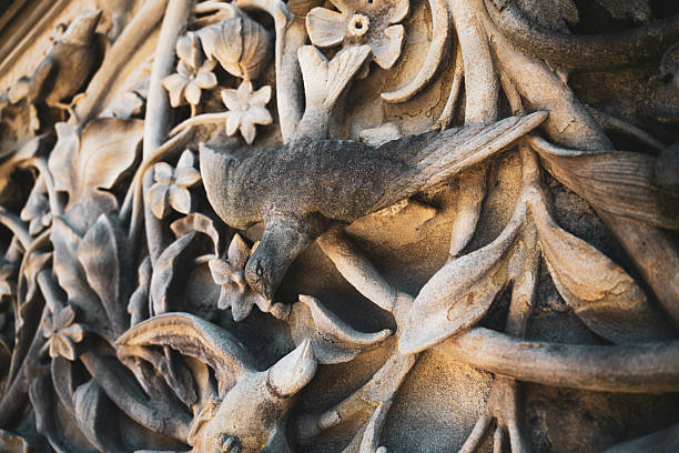 The intricate stone carvings on Bethesda Terrace were designed by Jacob Wrey Mould in 1873. He was an English-born architect and designer who collaborated with Calvert Vaux, the co-designer of Central Park. Mould was responsible for the detailed sculptural program on the Terrace's features, including the ramps, balustrades, and piers, which depict themes like the four seasons with elements like fruit, flowers, plants, and birds.