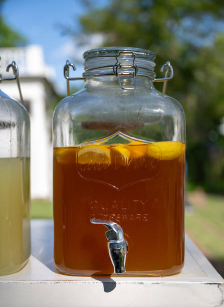 istock Tea With Floating Lemon in Glass Serving Jar 2205154523