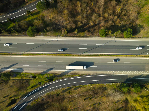 istock Aerial view of complex highway road junction with traffic moving 2205157549