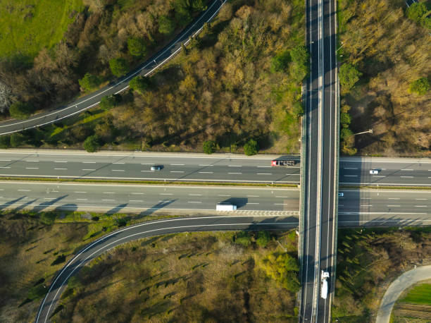 istock Aerial view of complex highway road junction with traffic moving 2205157554
