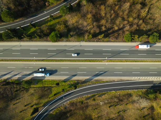 istock Aerial view of complex highway road junction with traffic moving 2205157558