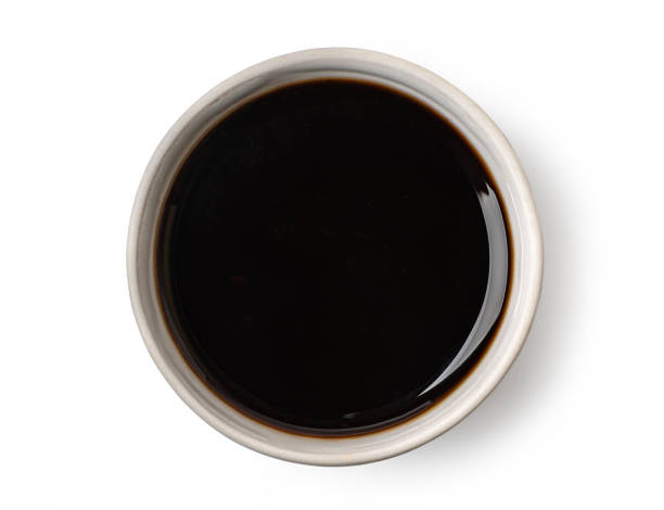 istock Small bowl containing soy sauce viewed from above on white background 2205158340