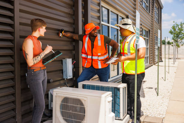 istock Detailed inspection. Diverse team of engineers evaluates air conditioning system. 2205158516
