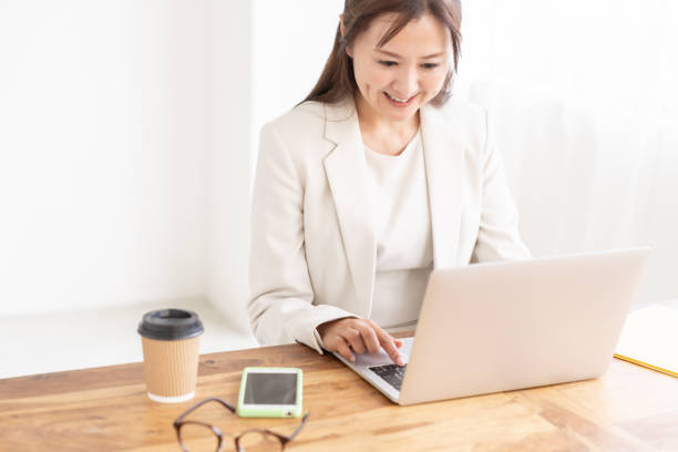 istock young asian businesswoman using laptop 2205162681