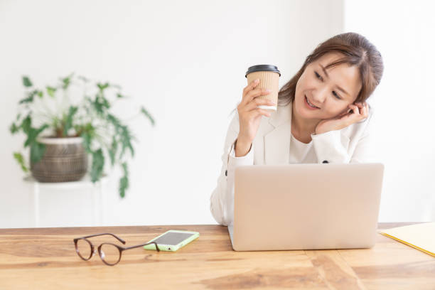 istock young asian businesswoman using laptop 2205162849