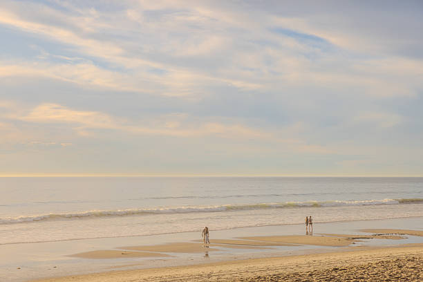 Carlsbad, California - November 30, 2024:  Visitors walking on Tamarack Surf Beach in a beautiful afternoon.  HDR encoded