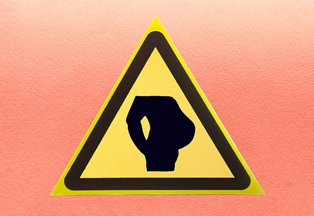 Abstract comic warning sign man with a big belly close-up