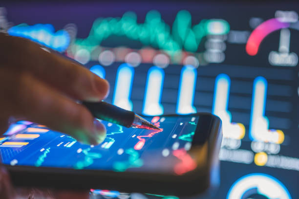 istock A close-up of someone analyzing financial trends on a digital device utilizing technology for early investments and financial growth 2205180740