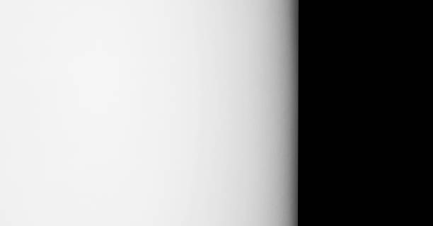 istock A sheet of white paper on a black background. 2205181361