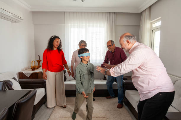 istock Family playing blind man's bluff 2205183519
