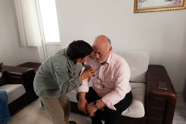 istock Father and grandson looking smartphone 2205183776